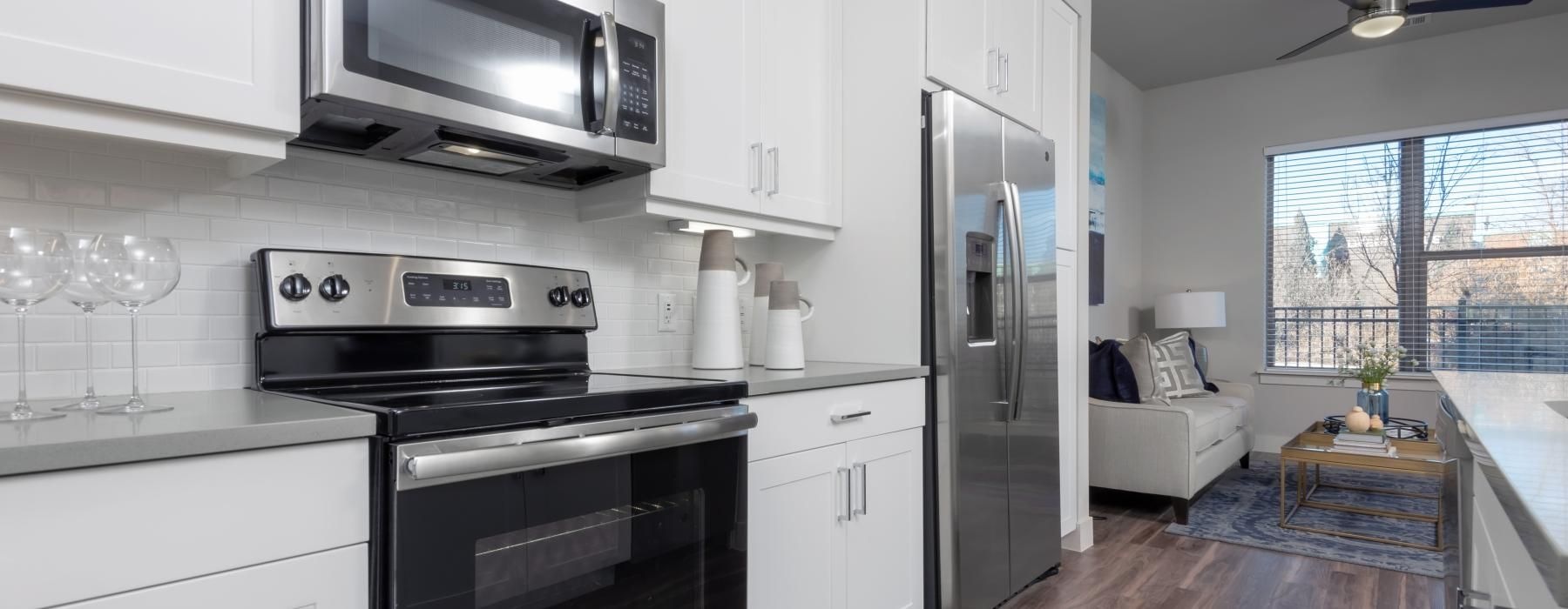a kitchen with white cabinets