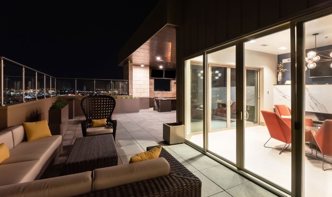 rooftop terrace with city views at night